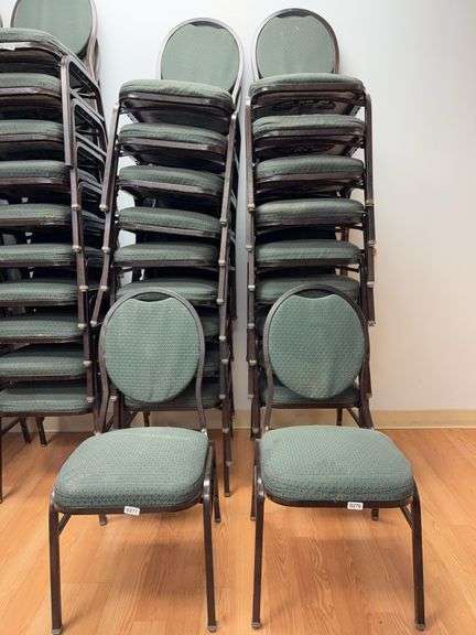 Event center chairs stack of 10 (bronze colored frame green Cushions image