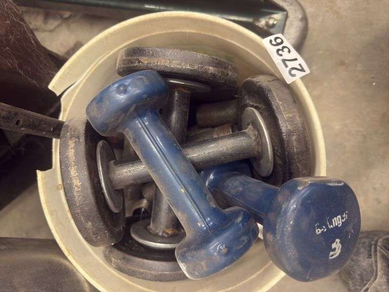 Bucket of weights and 1” black pipe sections image