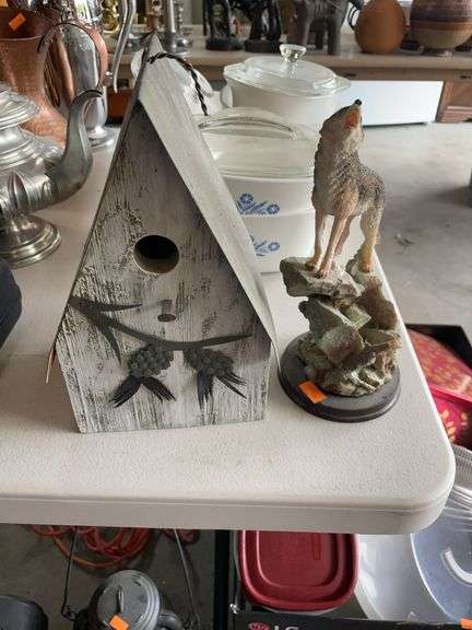 Birdhouse and wolf figurine image