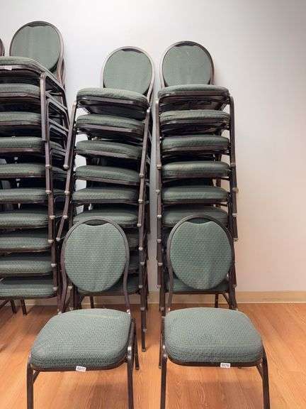 Event center chairs stack of 10 (bronze colored frame green Cushions image