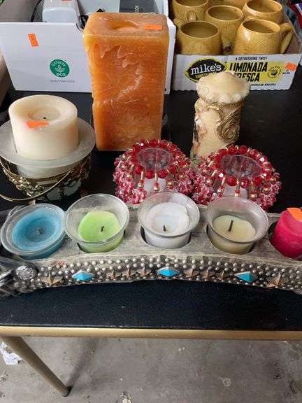 Lots of miscellaneous candles and holders image