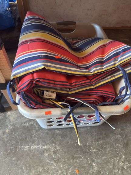 Hamper full of lawn chair padding image