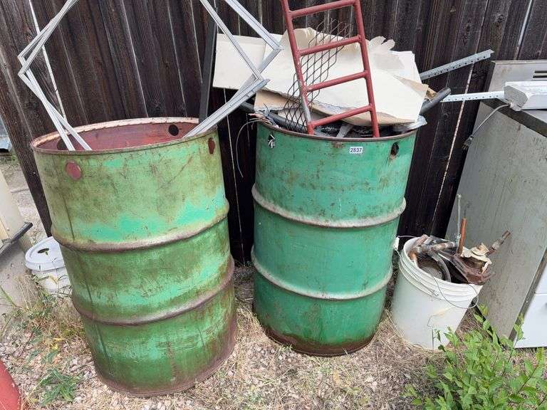 2 55 gallon barrels with scrap image