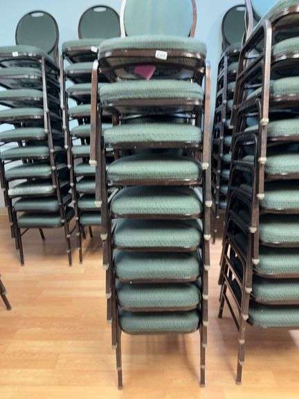 Event center chairs stack of 9 (bronze colored frame green Cushions image