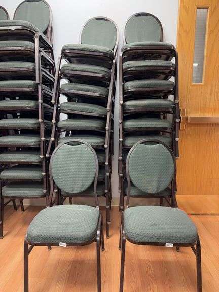 Event center chairs stack of 10 (bronze colored frame green Cushions image