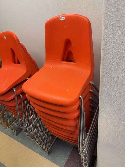 10 orange school style chairs image
