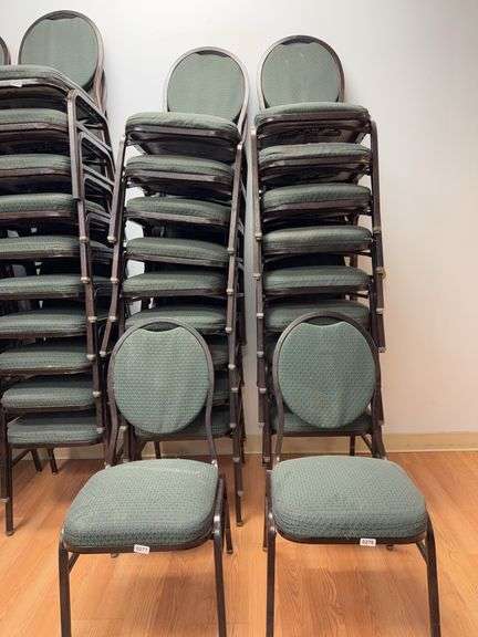 Event center chairs stack of 10 (bronze colored frame green Cushions image