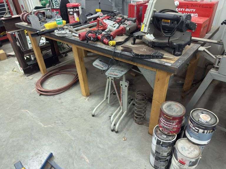 8”x4” wooden work bench. Items on and under the table not included image