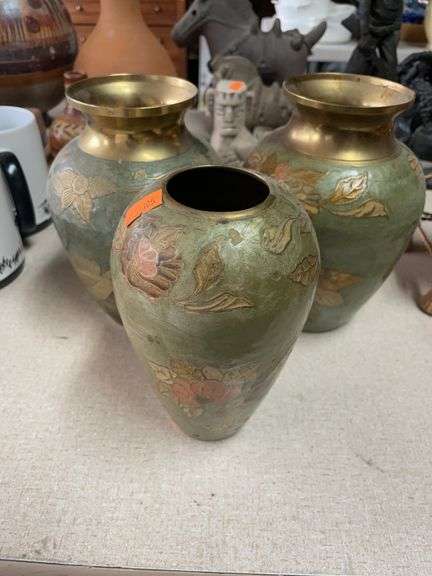 Lot of three brass vases image