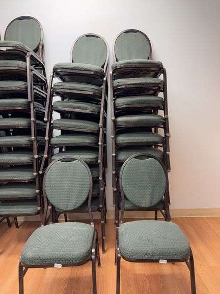 Event center chairs stack of 10 (bronze colored frame green Cushions image