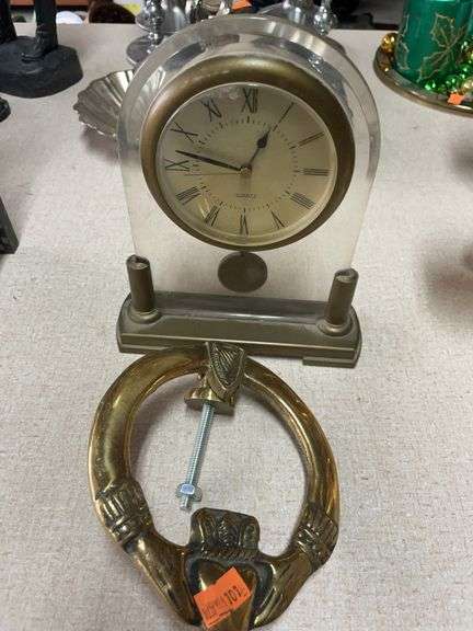 Brass door knocker and clock image
