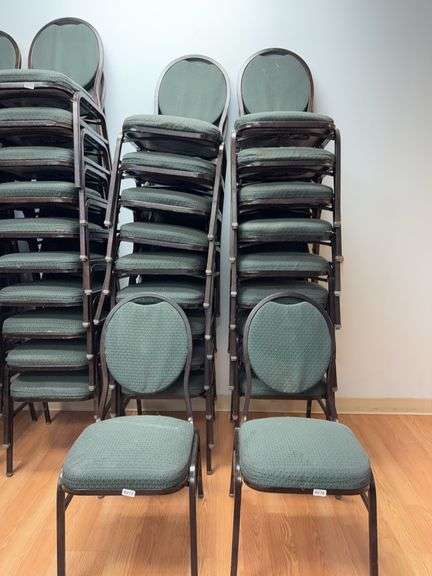 Event center chairs stack of 10 (bronze colored frame green Cushions image