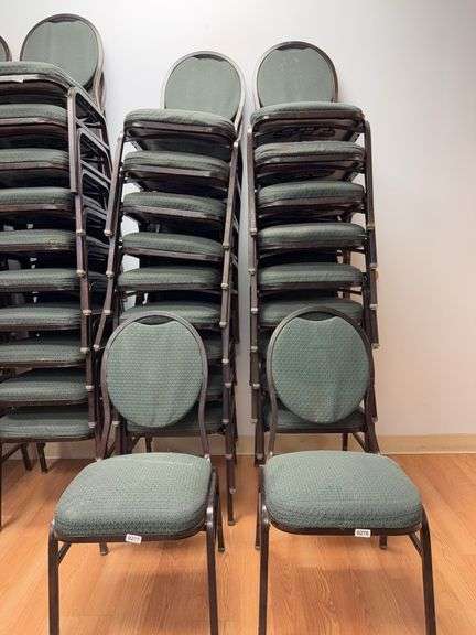 Event center chairs stack of 10 (bronze colored frame green Cushions image