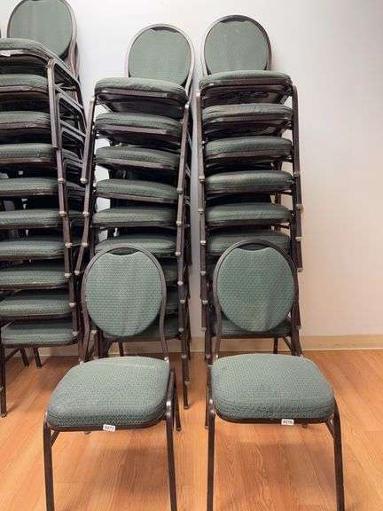 Event center chairs stack of 10 (bronze colored frame green Cushions image