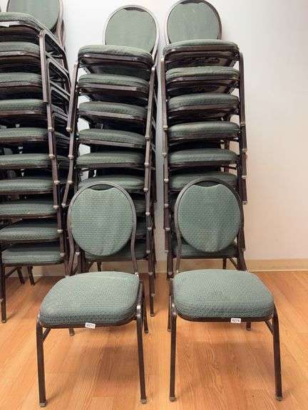Event center chairs stack of 10 (bronze colored frame green Cushions image