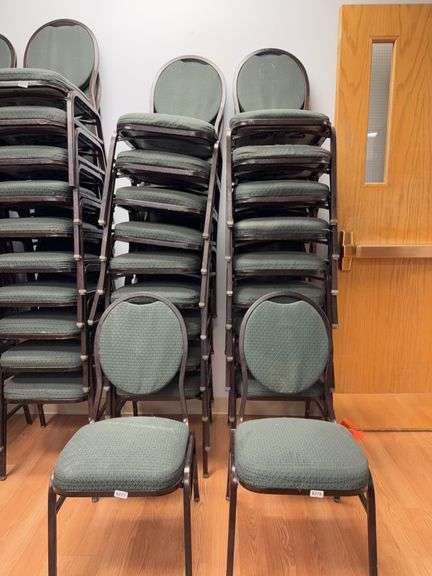 Event center chairs stack of 10 (bronze colored frame green Cushions image
