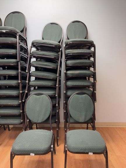 Event center chairs stack of 10 (bronze colored frame green Cushions image