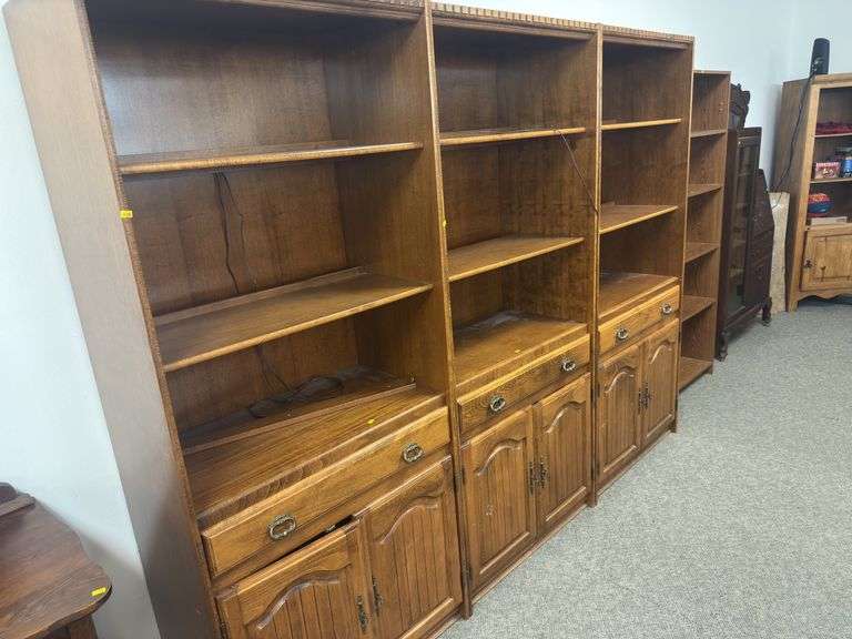 Large wooden shelving unit with back lighting image