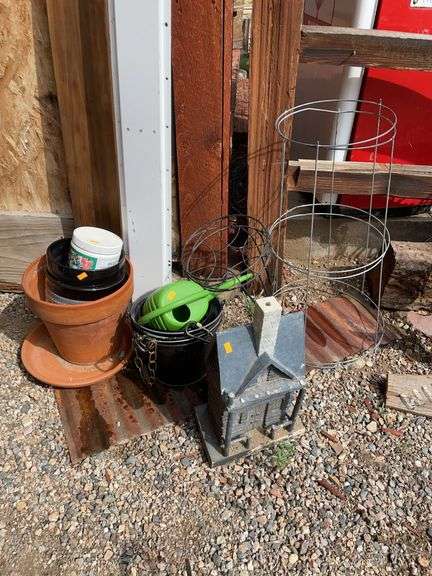 Miscellaneous pots watering can plant stand tomato rings, and yard decor image