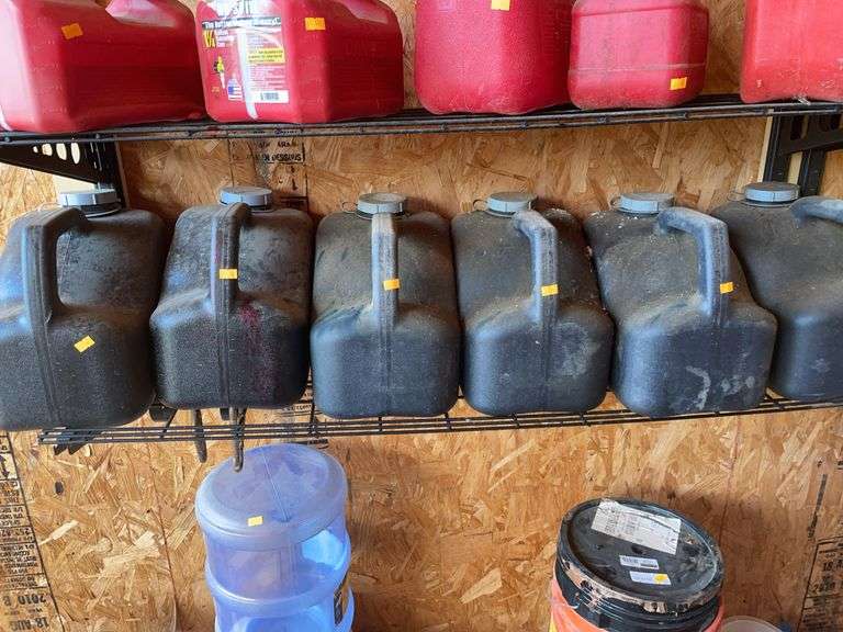 Six plastic containers with used oil image