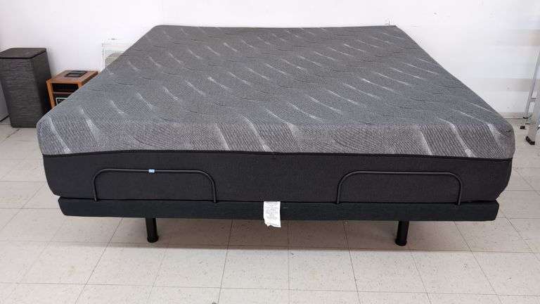 King sized adjustable bed with head/feet raising, massager