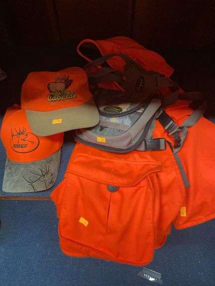 Two hunting vests, two caps and binocular case image