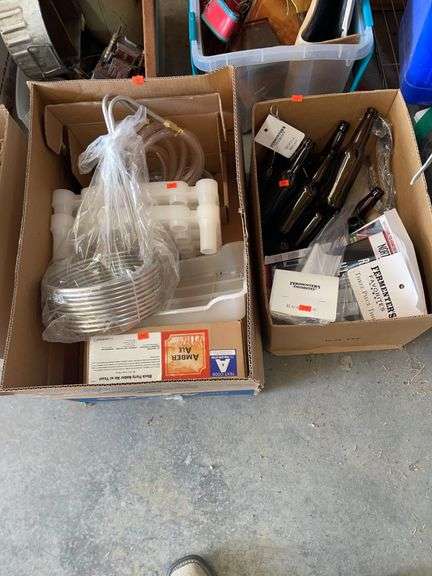 Two boxes of beer making equipment image