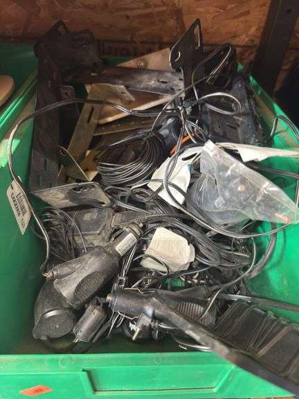 Assorted 12 V chargers and metal brackets image