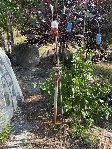 Wind, spinner, and antique pitchfork image