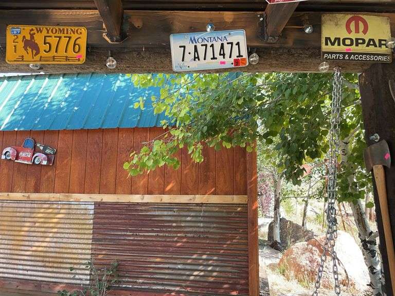 Two license plates and a sign image