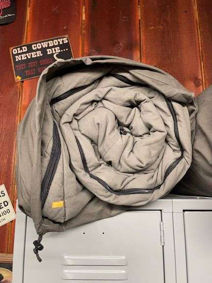 Large gray sleeping bag in canvas bag image