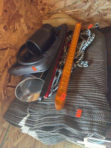 Muffler tips, license plate, frame, tiedown strap, tarp, tiedown rope and third brake lights image