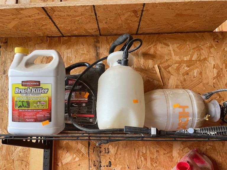 Two garden sprayers, and two containers of lawn chemicals image