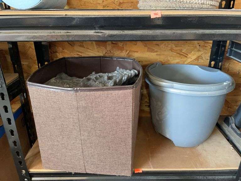 Contents of fourth shelf. Plastic bucket, and basket with ceramic figurines. image