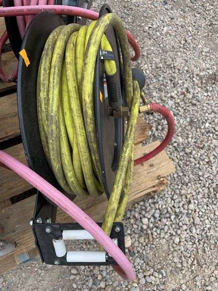 Central pneumatic retractable hose real with 50 foot air hose image