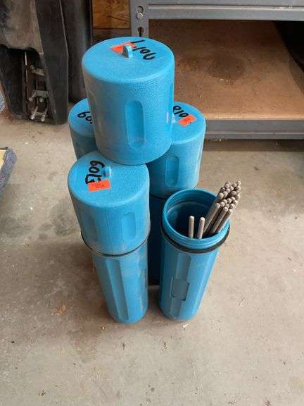 Four containers of welding rod image