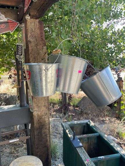 Four small metal buckets image