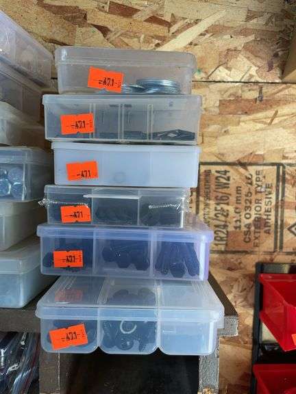 Six plastic containers of bolts screws, washers, and rubber washers image