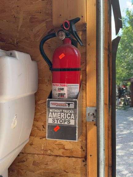 Fire extinguisher with holder buyer is responsible for proper removal image