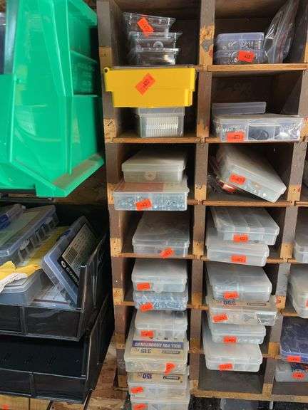 Row of plastic containers containing Circus screws rope pins, set screws, etc. image