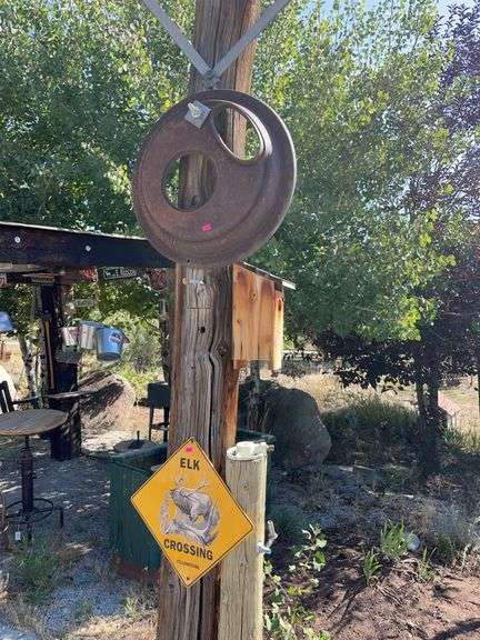 Birdhouse, antique stove, top, and elk Crossing sign image