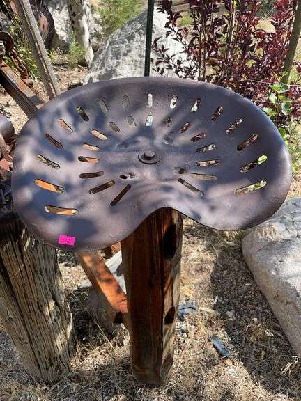 Antique metal implement seat image