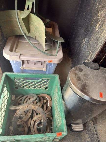 Tire chains stainless trashcan full of deicing, salt, hose holders, and horse shoes image