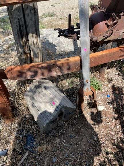 Birdhouse and antique post hole diggers image