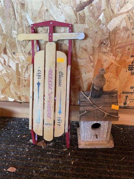 Birdhouse and small decorative sled image