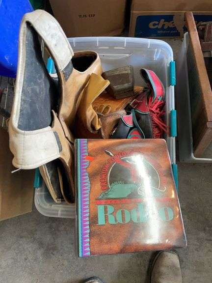 Plastic tote of rodeo gear and collectible cards. image