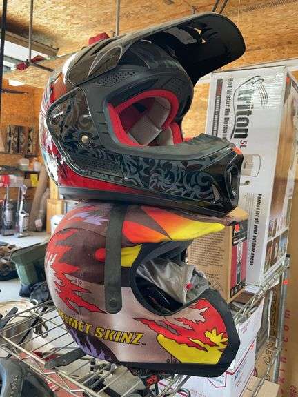 Two motorcycle helmets and two bicycle helmets image