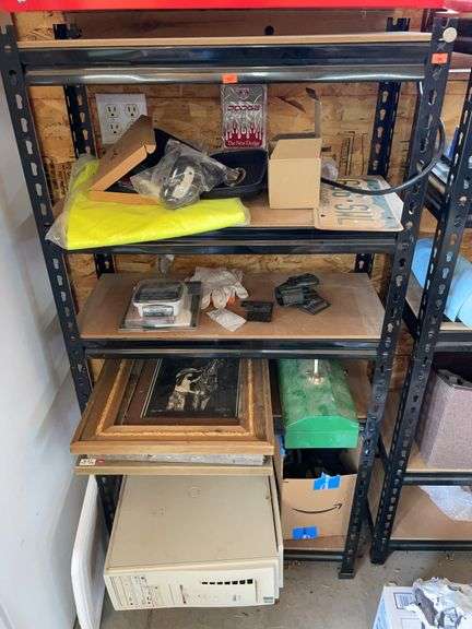 Contents of four shelves. Nylon straps, metal toolbox, Barnwood frames, and Del computer. image