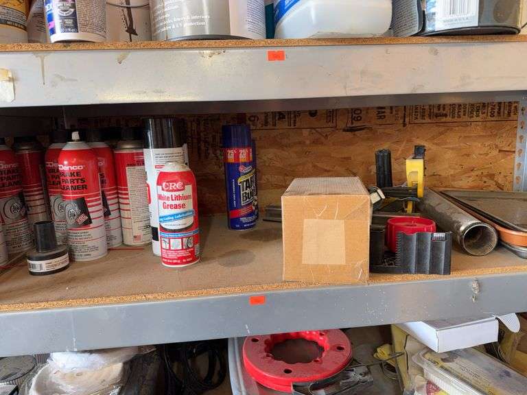 Contents of shelf has nine cans of brake cleaner image