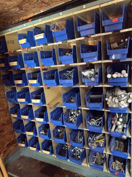 Lot of storage bins, full of hardware containing lag bolts, bumper bolts washers lock washers eyelets. Bins A-G image